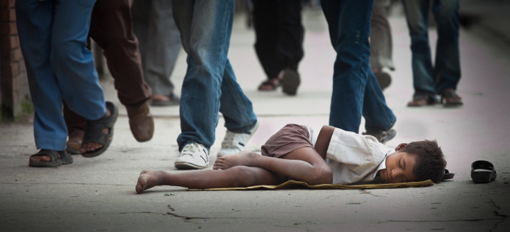 epa02870618 A Nepalese street child sleeps on Thamel street in Kathmandu, Nepal, 18 August 2011. According to Child Workers in Nepal Concerned Centre (CWIN), there are 8,000 to 9,000 street children in the Nepalese capital of Kathmandu and every year around 500 children land in the streets of Kathmandu coming from different districts of Nepal with the hope to find a better future.  EPA/NARENDRA SHRESTHA