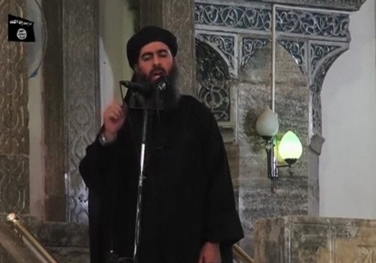 A man purported to be the reclusive leader of the militant Islamic State Abu Bakr al-Baghdadi has made what would be his first public appearance at a mosque in the centre of Iraq's second city, Mosul, according to a video recording posted on the Internet on July 5, 2014, in this still image taken from video. There had previously been reports on social media that Abu Bakr al-Baghdadi would make his first public appearance since his Islamic State in Iraq and the Levant (ISIL) changed its name to the Islamic State and declared him caliph. The Iraqi government denied that the video, which carried Friday's date, was credible. It was also not possible to immediately confirm the authenticity of the recording or the date when it was made. REUTERS/Social Media Website via Reuters TV (IRAQ - Tags: POLITICS) ATTENTION EDITORS - THIS IMAGE HAS BEEN SUPPLIED BY A THIRD PARTY. IT IS DISTRIBUTED, EXACTLY AS RECEIVED BY REUTERS, AS A SERVICE TO CLIENTS. REUTERS IS UNABLE TO INDEPENDENTLY VERIFY THE CONTENT OF THIS VIDEO, WHICH HAS BEEN OBTAINED FROM A SOCIAL MEDIA WEBSITE - RTR3X9BC